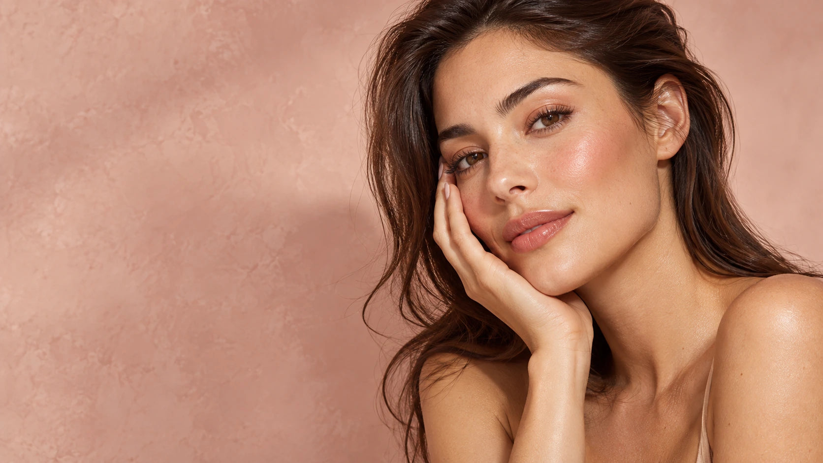 Beauty campaign portrait in soft rose studio light